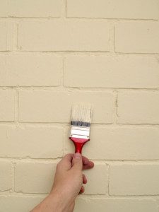 painting bricks with brush